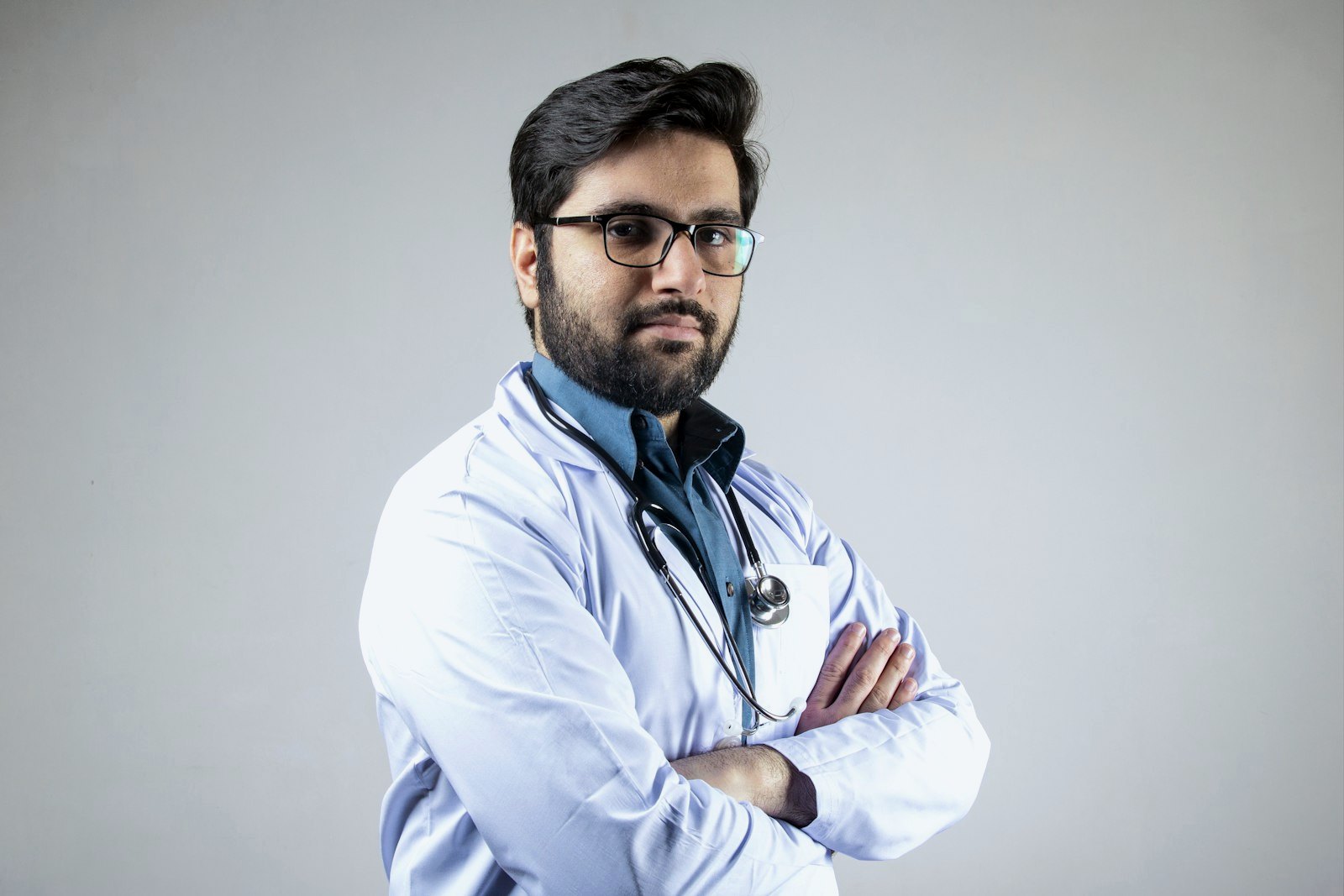 Doctor with stethoscope, arms crossed